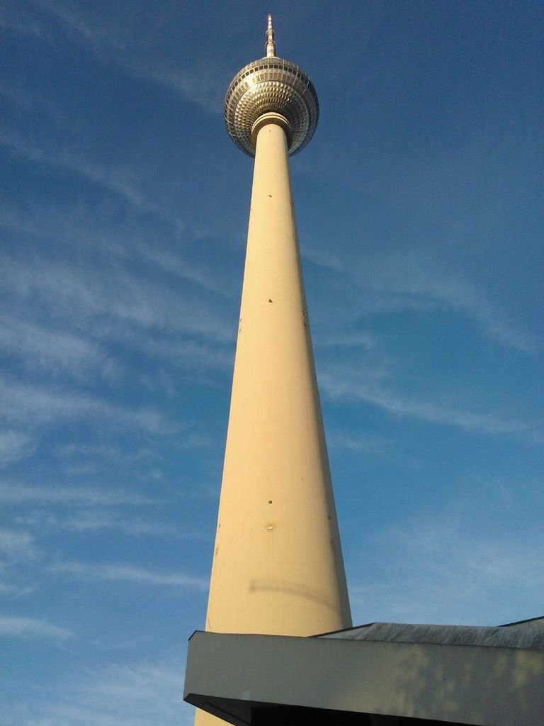 tower, tall - high, international landmark, architecture, communications tower, built structure, famous place, tourism, capital cities, travel destinations, low angle view, building exterior, travel, communication, television tower, culture, spire, fernsehturm, sky, sphere