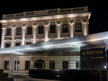 Low angle view of illuminated building at night