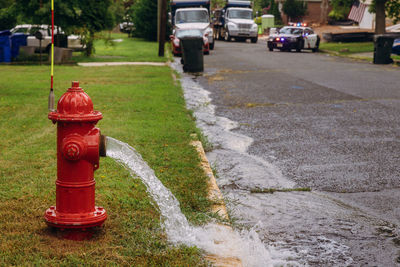 Red fire hydrant on road in city