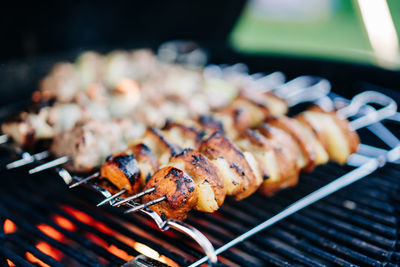 Close-up of meat on barbecue grill