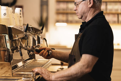 Cropped hand of man working in workshop