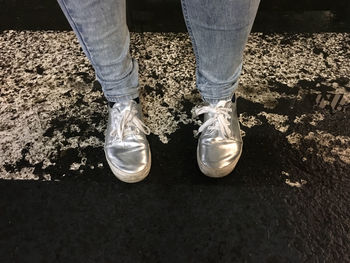 Low section of man standing outdoors