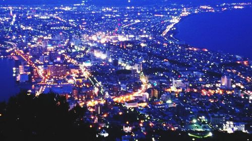 High angle view of illuminated buildings at night