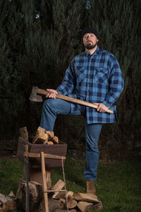 Full length of man holding umbrella