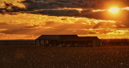 Built structure against sky during sunset