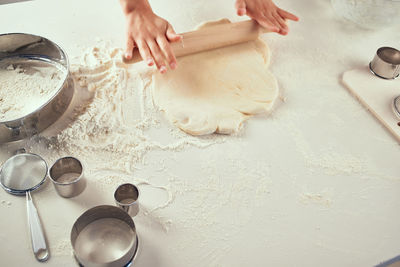 Midsection of woman preparing food on table