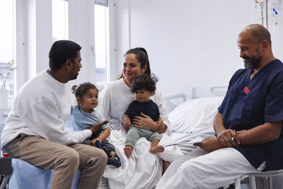 Parents with children in hospital room