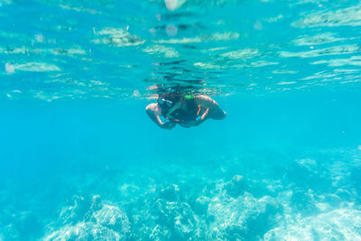 Person swimming in sea