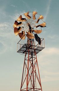 Low angle view of windmill on sky