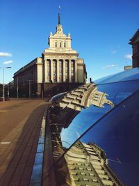 Low angle view of buildings against blue sky