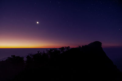 Scenic view of sea against sky at night