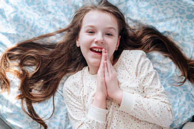 Portrait of beautiful young woman sitting at home