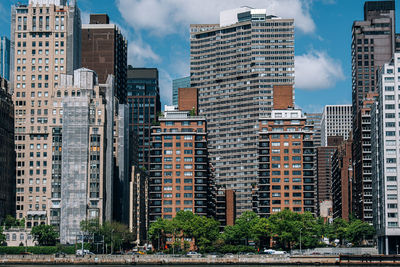 Modern buildings in city against sky