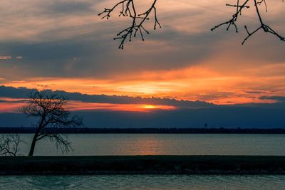 Scenic view of sea against orange sky