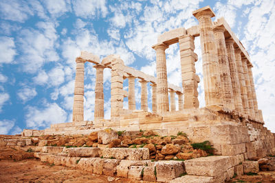 Old ruins of temple against cloudy sky