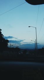 Cars on road against sky