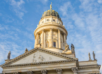 Low angle view of german cathedral against sky at gendarmenmarkt, berlin, germany