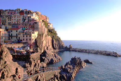 Panoramic view of sea and buildings against sky