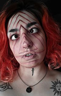 Close-up of young woman with face paint