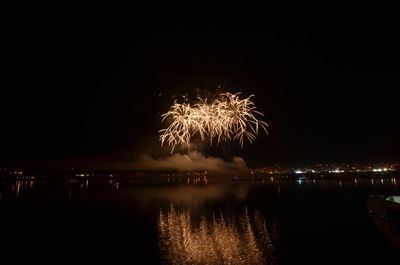 Firework display at night