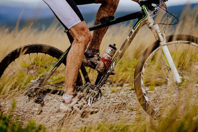 Low section of man riding bicycle