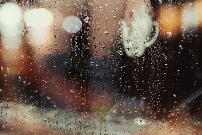 Close-up of wet glass during rainy season