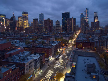 High angle view of illuminated buildings against sky