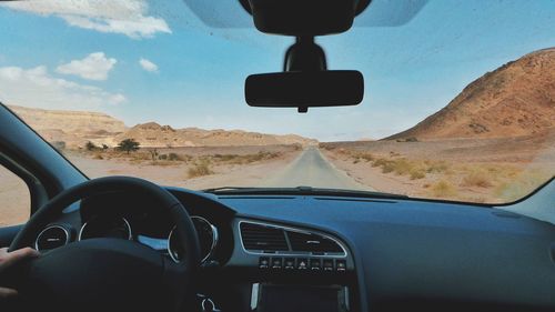 Cropped image of car on road