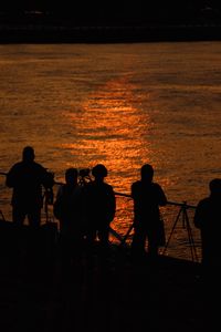 Silhouette people at sunset