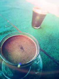 High angle view of coffee cup on table