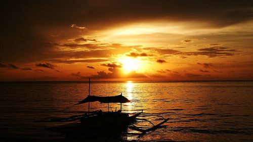 Scenic view of sea at sunset