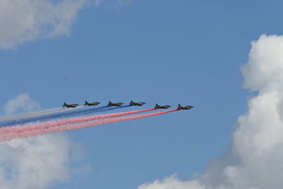 Low angle view of airshow in sky