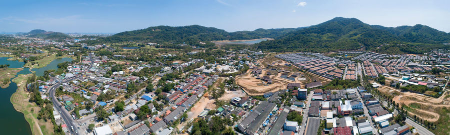 High angle view of buildings in town against sky