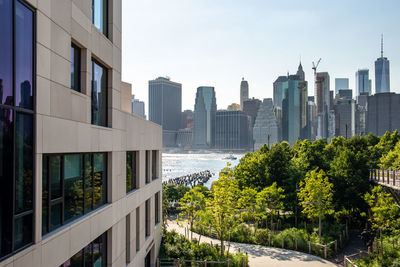 Modern buildings in city against sky