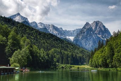 Scenic view of lake and mountains against sky