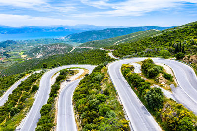 High angle view of road amidst mountains against sky