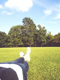 Man relaxing on grassy field