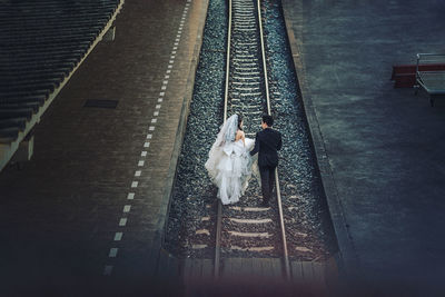 High angle view of dog on railroad tracks