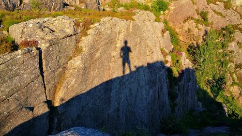 Shadow of man on cliff
