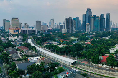 High angle view of buildings in city against sky