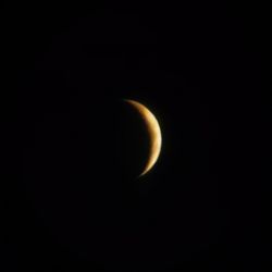 Low angle view of moon against sky at night