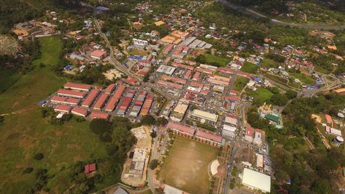 High angle view of buildings and trees in city