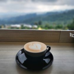 Close-up of coffee cup on table