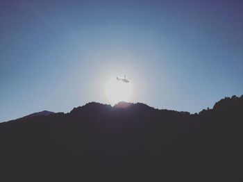 Low angle view of silhouette mountain against sky