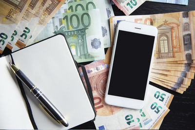 High angle view of smart phone on table
