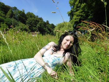 People relaxing on grassy field