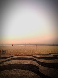 Scenic view of calm sea at sunset