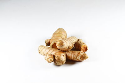 Close-up of bananas against white background