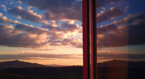 Scenic view of silhouette mountains against sky during sunset