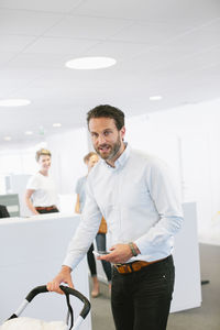 Man with buggy in office